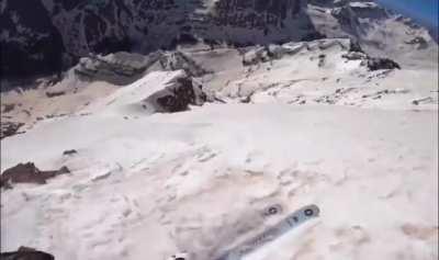 Skier snags a rock trying to ski down a 1000 ft slope in Aspen, CO