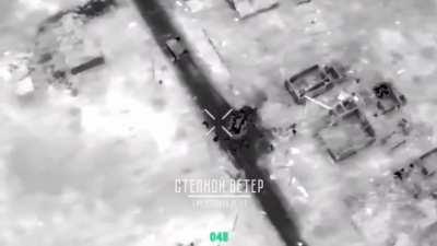 Drone drop on soldier unloading ammunution from M113 APC