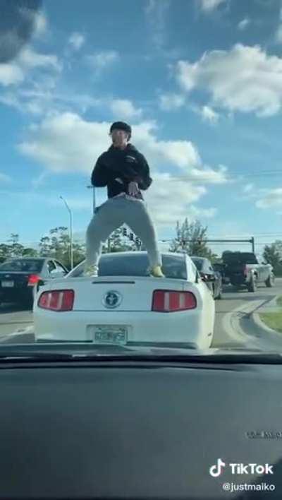 Dancing on someone else's car for views