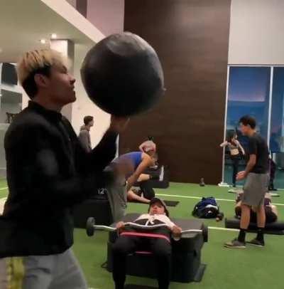 Punching a 20lb medicine ball so fast it looks like it's floating