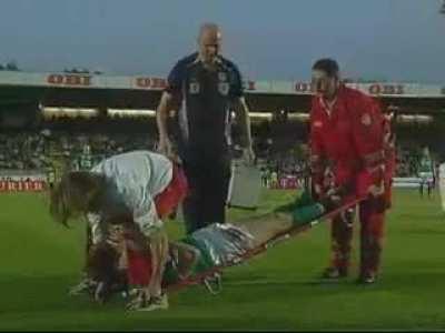 Footballer gets butt shoved into his face while getting taken away on a stretcher