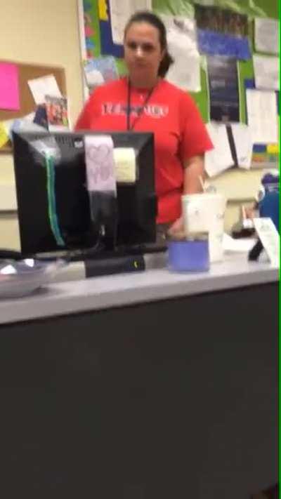 Student hides under desk and grabs teacher's ankles