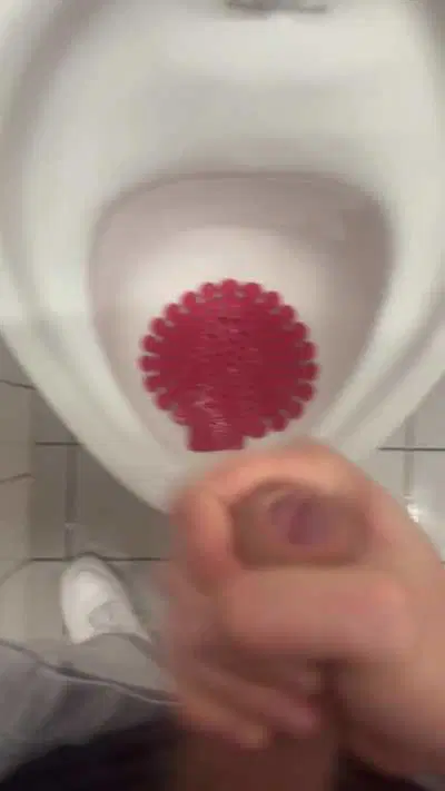 Cumming at the public urinal 