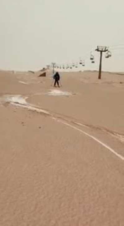 Skiing in Sierra Nevada (south of Spain), on slopes covered by dust from the Sahara desert