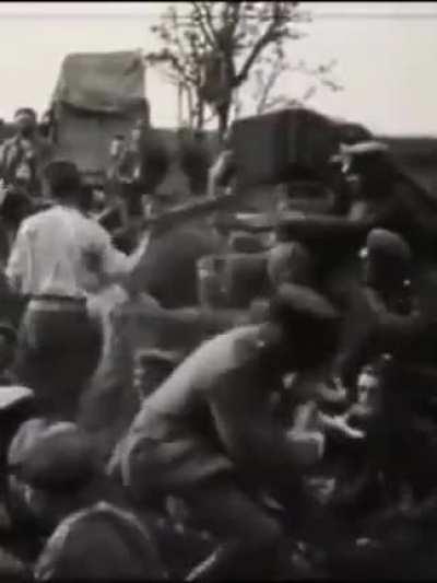 In this video from World War I, soldiers are playing with a puppy