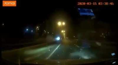 Car flips over median and nearly collides head-on