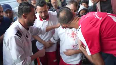 A Gaza medic realizes he’s carrying his own mother’s body, killed by an Israeli airstrike