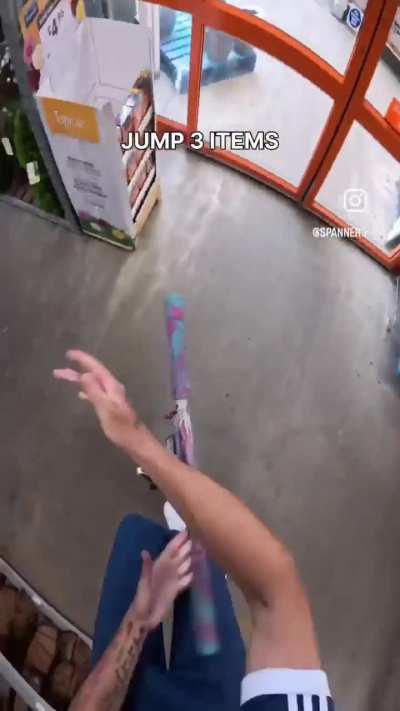 A guy enters with a Scooter in a bricolage store