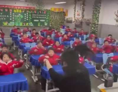 Children in China are required to exercise between different lessons in school