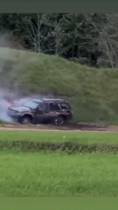 The M134 Mini Gun with tracers looks like a sci-fi weapon while demolishing this Jeep Grand Cherokee.