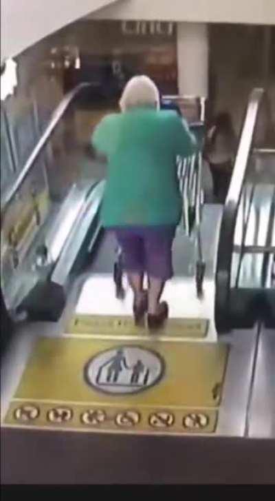 Going down an escalator with a cart