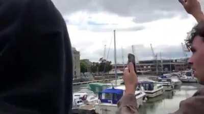 Demonstrators in Bristol, England pull down a statue of Edward Colston, a 17th century slave trader, &amp;amp; throw it in the river