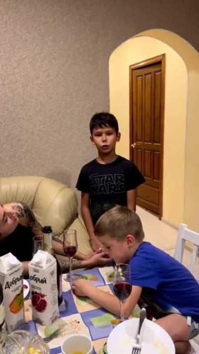 Kid hits vape while his brother thanks their mom for raising him well