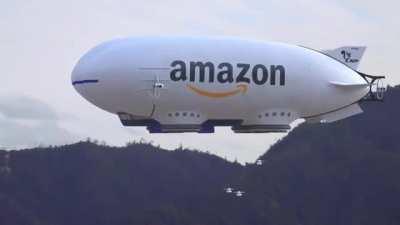 Amazon blimp releasing drones