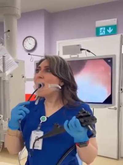 A Gastroenterology Professor performs endoscopy on herself as a demonstration!