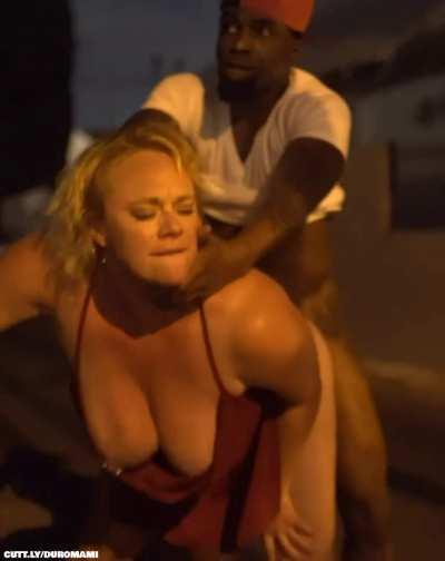 Blonde top heavy milf in a red dress can't wait and gets her cheeks clapped in public