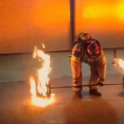 50 y.o. firefighter deadlifts 600 lbs. of flaming steel to celebrate his retirement.