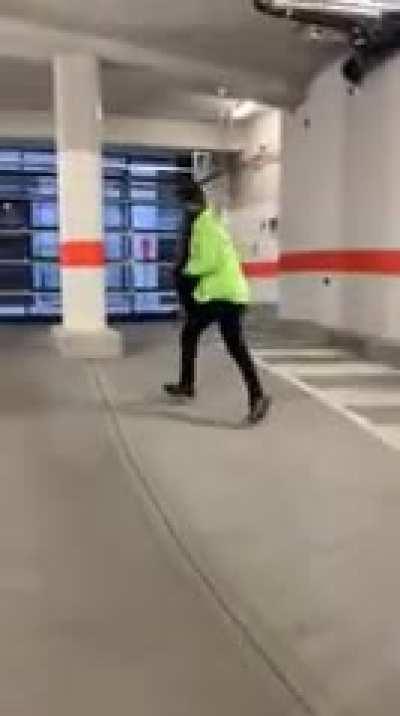 The guy was caught stealing from a car and started running. The parking garage did the rest.