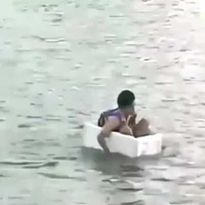 An elementary school student in indonesia goes to school by sailing on a styrofoam box