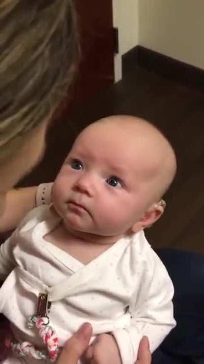 Baby hears Mom for the first time after receiving hearing aids