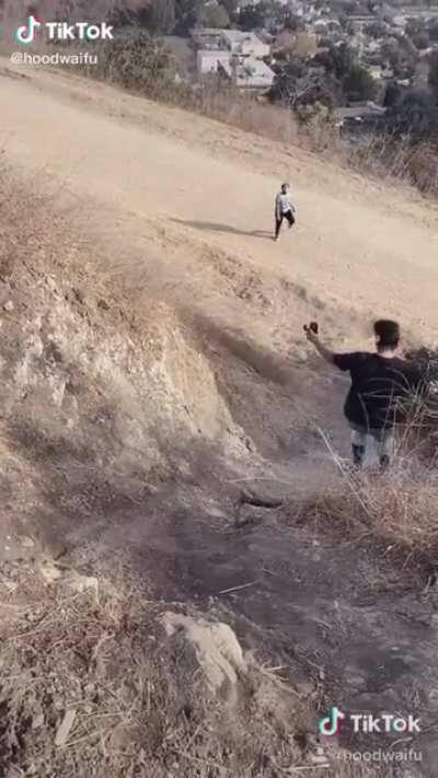 A girl takes a hard tumble while going downhill