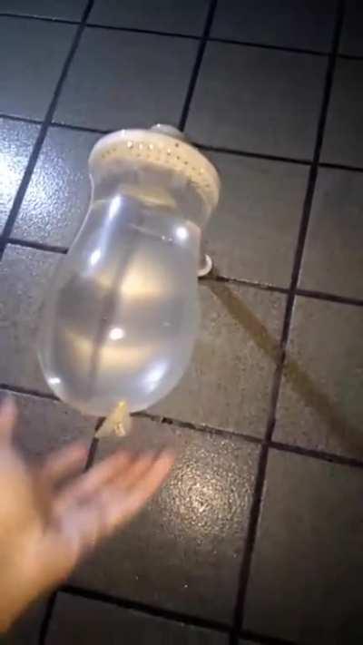 putting a condom on a shower head