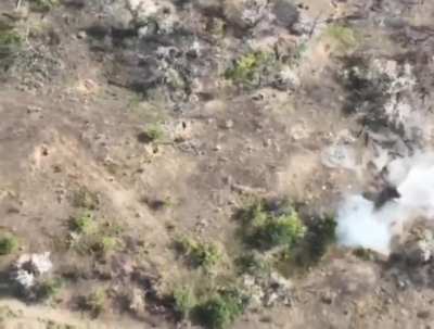 Pair of UAF soldiers walking. One is struck by an FPV drone. The other soldier safely abandons him. 