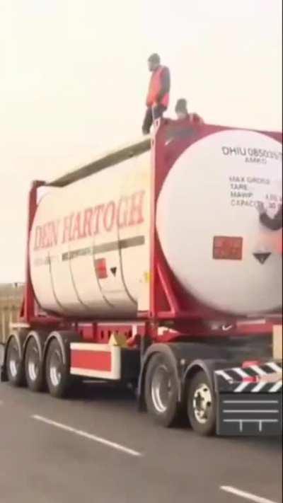 climate activists glued themselves to a tanker of cooking oil