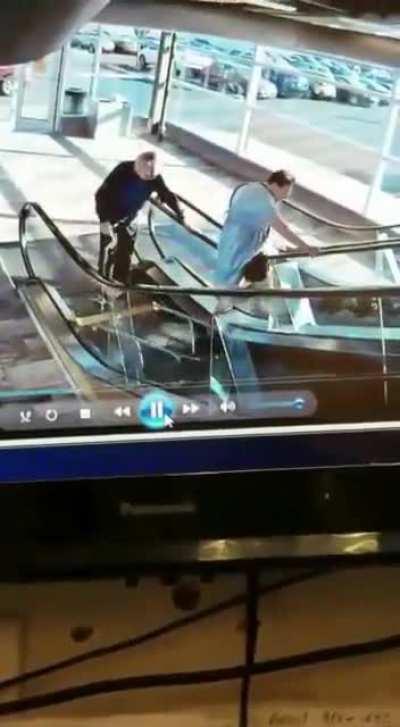 Disabled Couple struggle with escalator