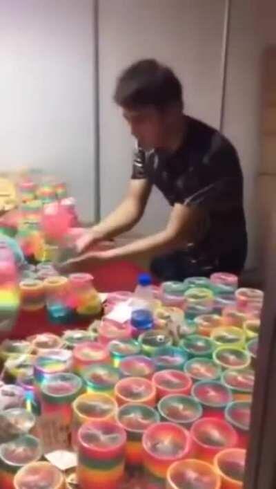 This guy knows how to play with Slinky Rainbow Toy.