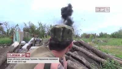 Separatist giving an interview is interrupted by a pair of incoming artillery rounds - Horlivka, Ukraine - 2015