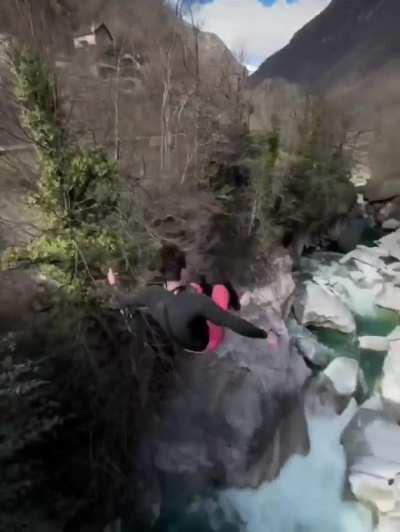A beautifully executed dive from a bridge