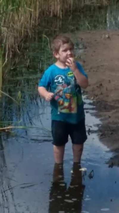 My son tries wild corn dog. It must not have been ripe yet (I know I sound like Darth Vader, ignore my loud breathing)