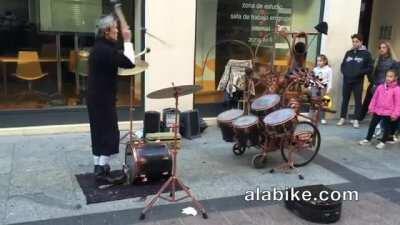 Street Performer Juggles Sticks While Playing The Drums