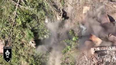 Two Russian soldiers standing still to avoid drone detection and getting hit anyway (1st Assault Battalion)