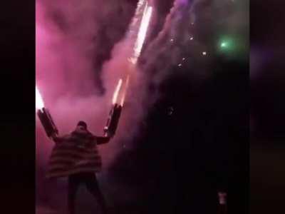 Absolute chad firing strapped to his arms to celebrate fourth of July