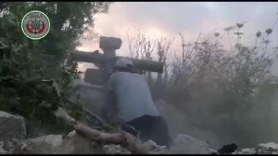 Syrian rebels blowing up a group of regime fighters with an ATGM in Northern Latakia