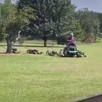 This guy has rigged up a whole army of mowers to keep his lawn looking great!