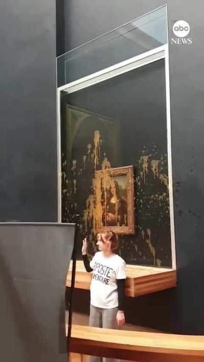 Activists splattered the glass-covered &quot;Mona Lisa&quot; painting with soup