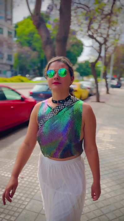 Walking Braless in a colourful top in public.