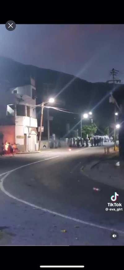 Armed soldiers killing protesters in Venezuela