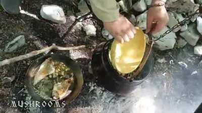 Viking cooking porridge with hare