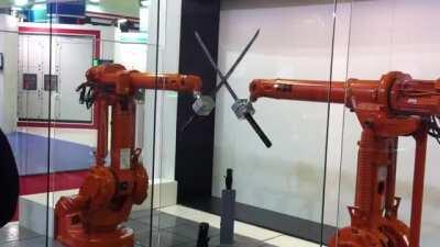 Robots showing off precision with katanas