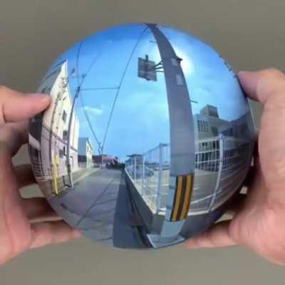 A photorealistic spherical painting by Daisuke Samejima