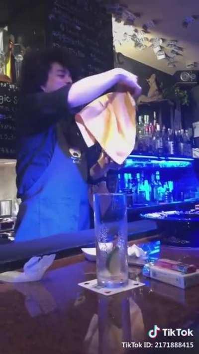 A wizard behind a bar.