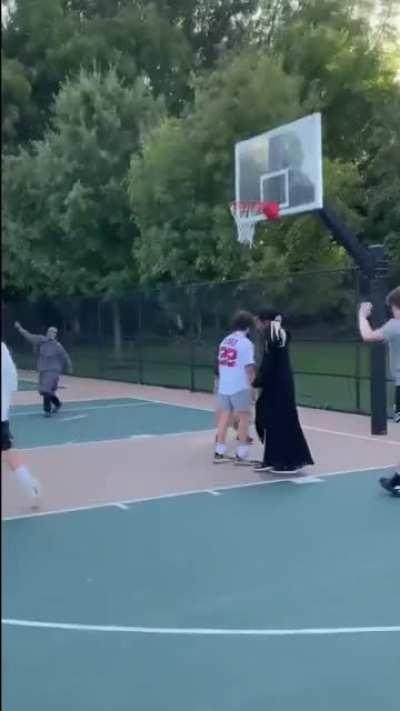 Muslim girl playing basketball and casually kicking ass