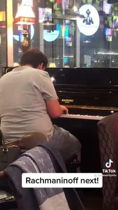 Dad encourages his son to play piano in a crowded airport. You can tell he doesn’t push, he encourages based on trust and it warmed my heart.