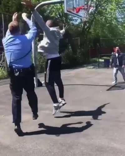 Officer shooting some hoops