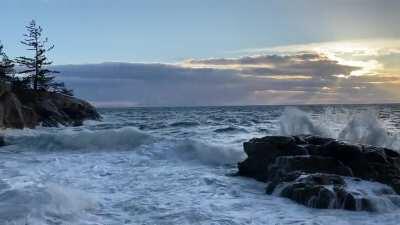 Angry ocean accompanied by sunbeams at Lighthouse park right now!