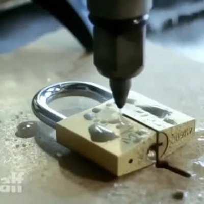 Padlock cut in half via water jet cutter